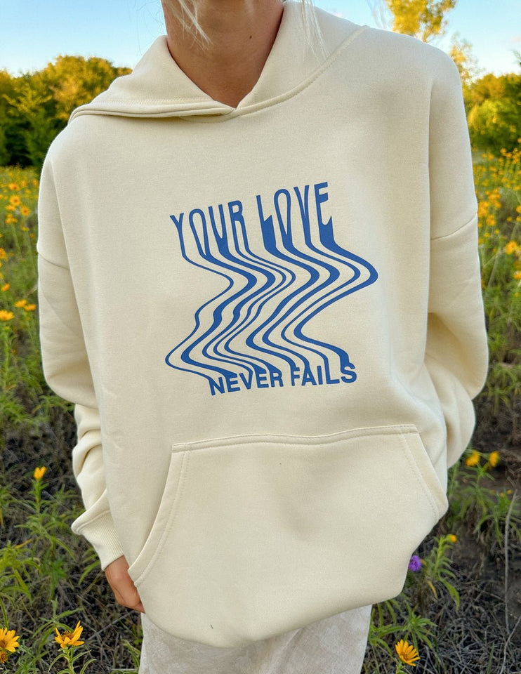 Love Never Fails Cream Unisex Hoodie - Wear with style